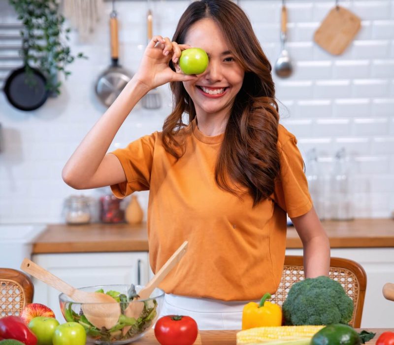beautiful-young-woman-happy-portrait-cooking-fresh-organic-clean-food-fruit-at-home-modern-kitchen-3.jpg